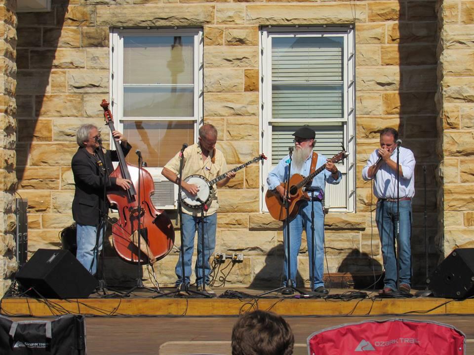 Performers on stage in front of courthouse